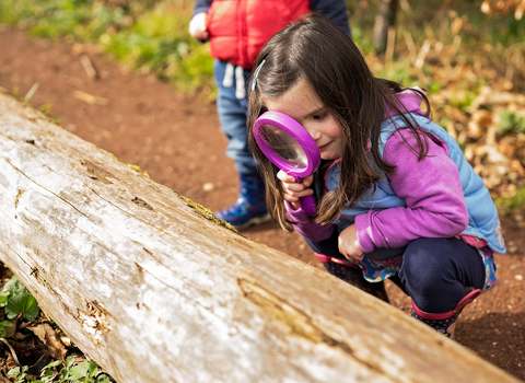 Girl with magnifying glass