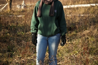 Elaine stands on a nature reserve