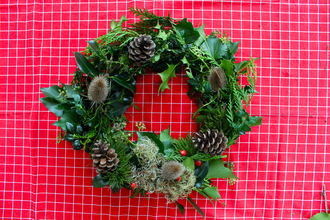 A seasonal wreath made from natural materials provided in our Christmas wreath kit.