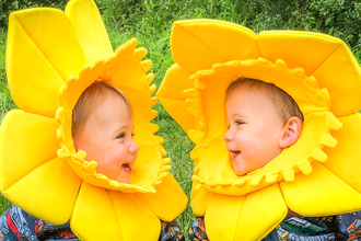 Two children dressed up as daffodils 