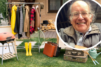 A photo of Martin Buckland in a circle, with items in a garage sale in the background, such as a clothes wrack, a barbecue and suticases
