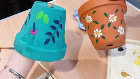 Two painted plant pots