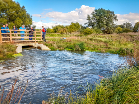 BBOWT staff removing the final 'stop logs' to fully open the new WEG channel at Chimney Meadows in October 2022. Picture: Lisa Lane