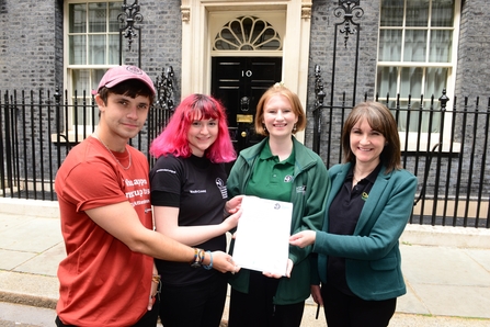 Representatives of the Wildlife Trusts delivering a High Speed Two (HS2) petition to Number Ten Downing Street, London